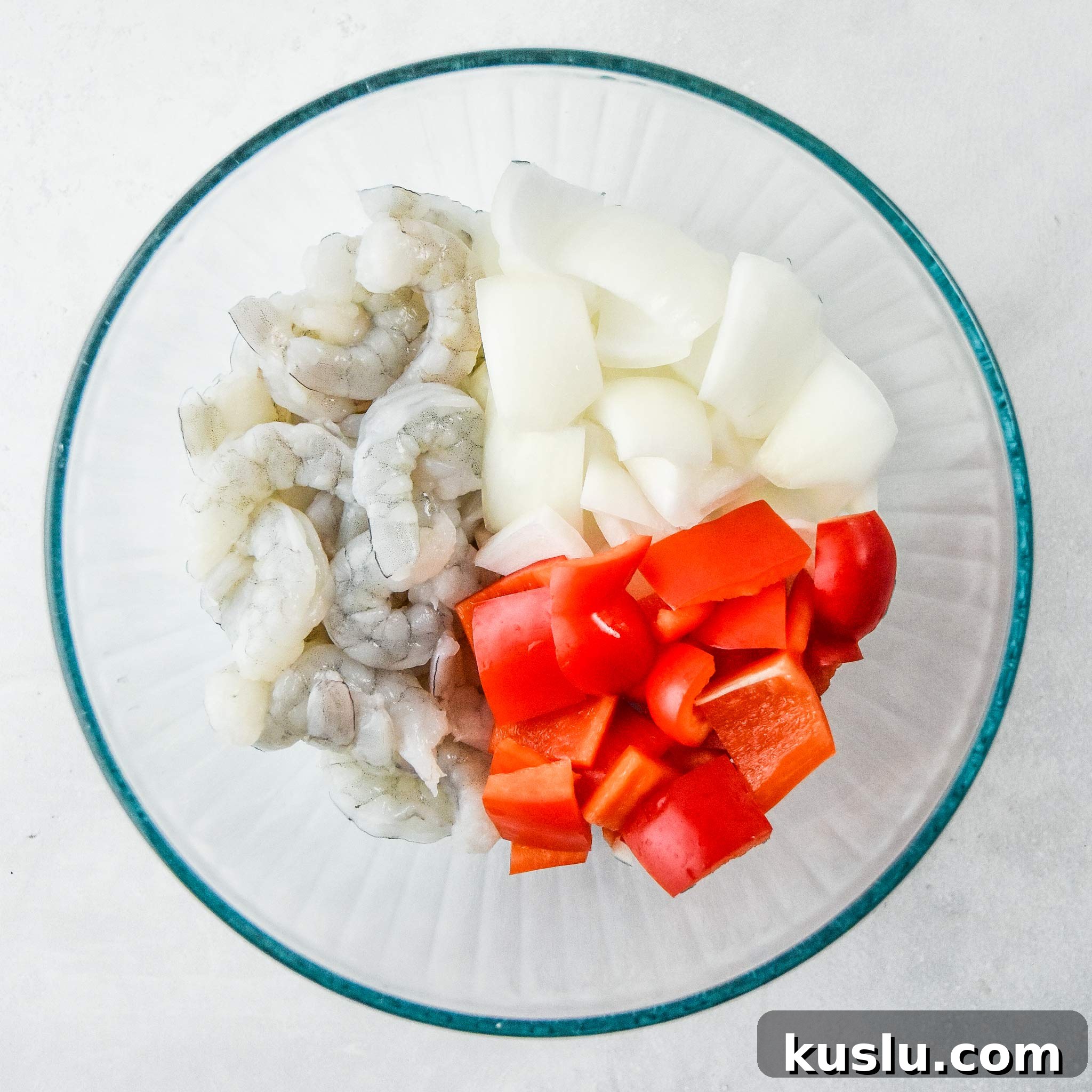 Crispy Air Fryer Shrimp with Roasted Vegetables 3 veggies and raw shrimp prepped in a bowl