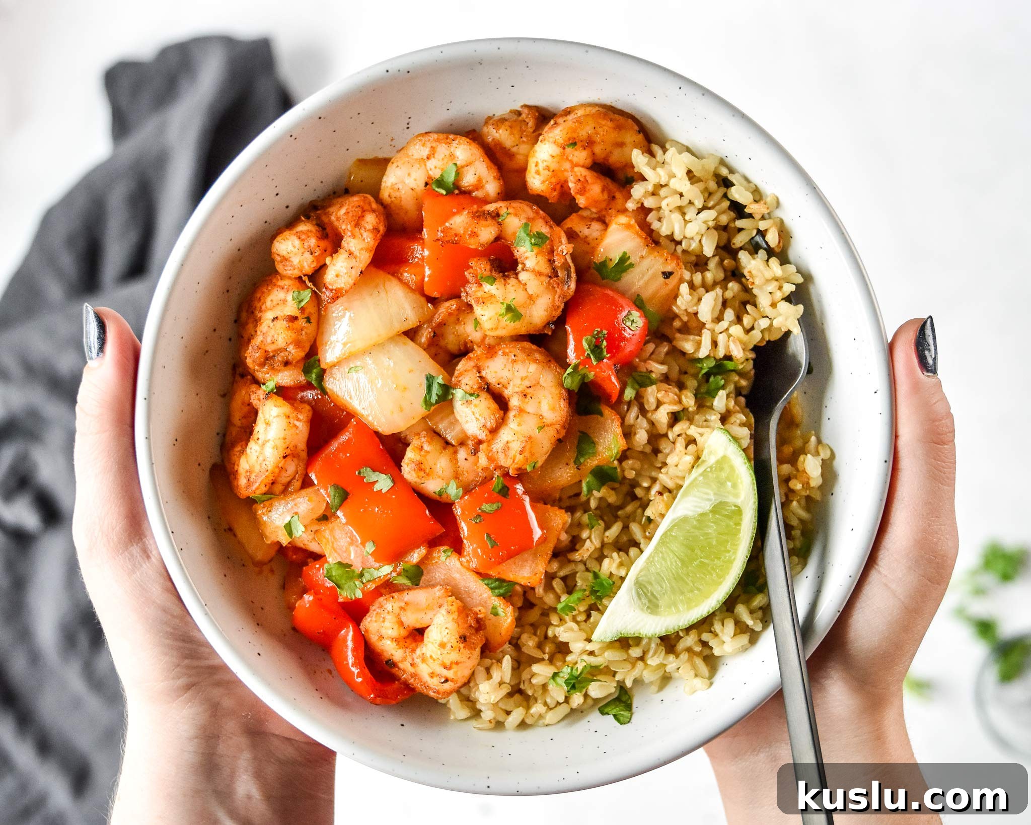 Crispy Air Fryer Shrimp with Roasted Vegetables 9 easy air fryer shrimp and vegetables served with rice and a lime wedge