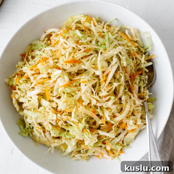 Vinegar coleslaw in a white bowl.