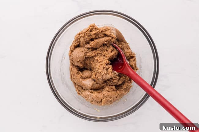 Chewy Peanut Butter Cookie Bars Recipe for Crowd-Pleasing Treats 5 Cookie dough in a bowl.