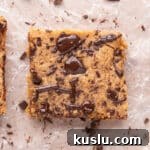 Chewy Peanut Butter Cookie Bars Recipe for Crowd-Pleasing Treats 9 Cookie bar topped with chocolate chips.