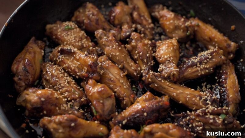 Korean honey garlic chicken wings garnished with toasted sesame seeds