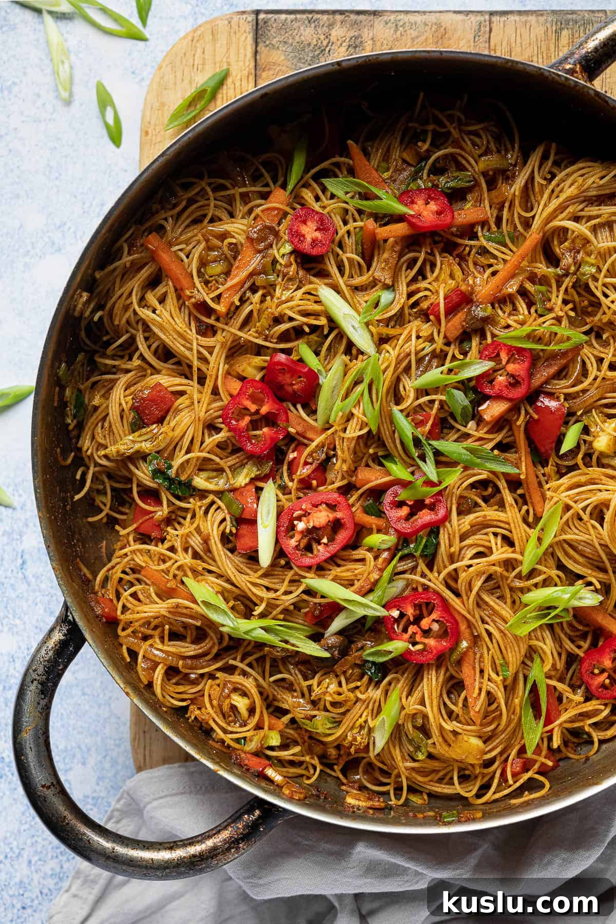 Close up of a pan of vegan curry noodles.