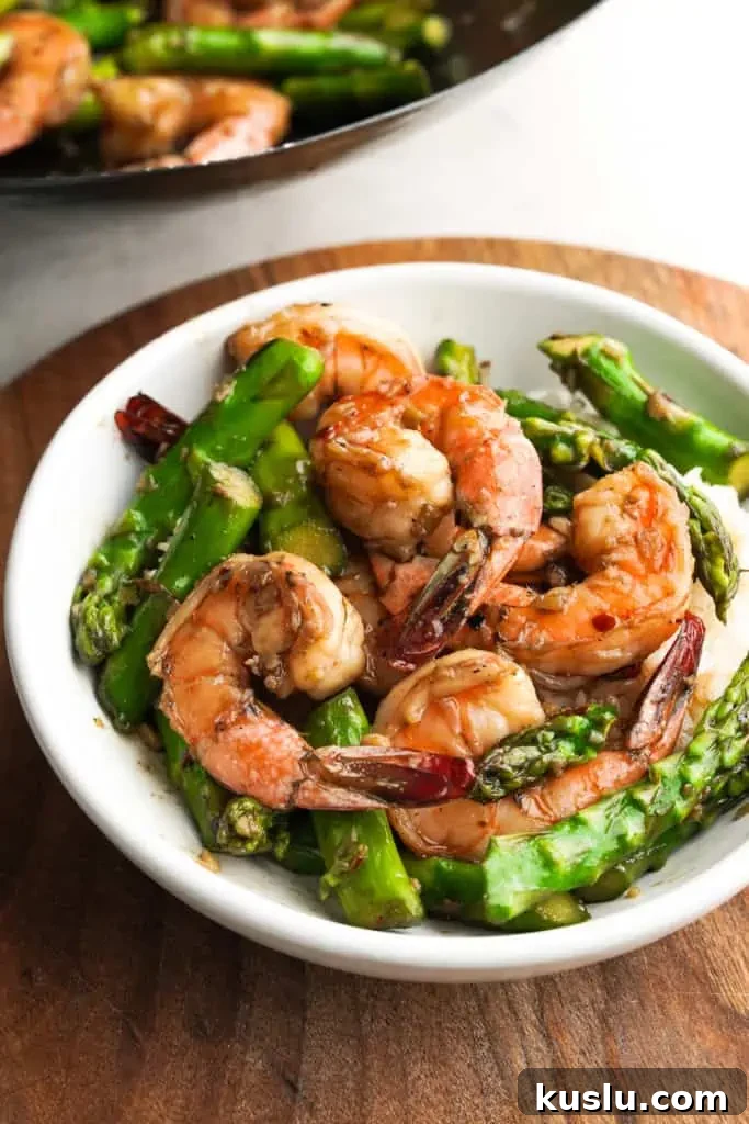shrimp and asparagus stir fry in bowl
