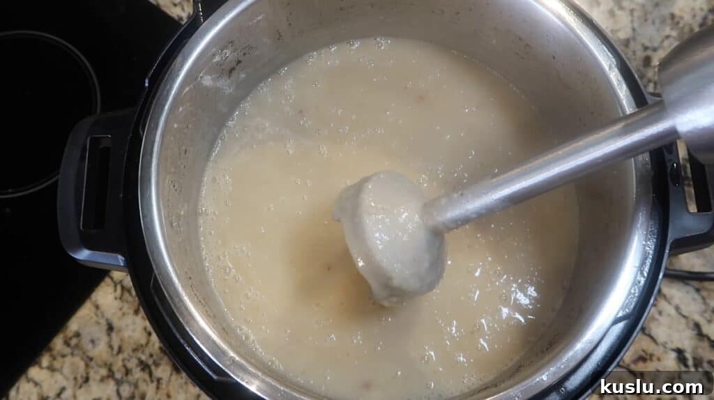 Blending soup until puréed