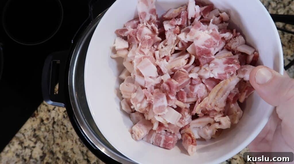 Adding diced bacon to pot