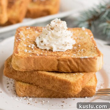 three pieces of french toast with whipped cream on top
